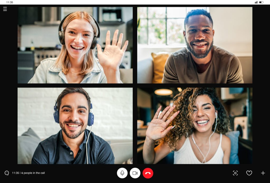 four people smiling for the camera on a video call